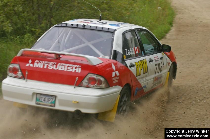 Jan Zedril / Jody Zedril take a fast left-hander on the practice stage in their Mitsubishi Lancer ES.