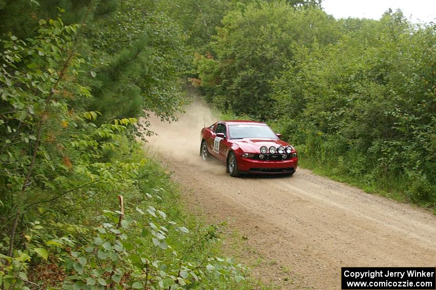 Mark Utecht / Rob Bohn blast down a straight on the practice stage in their Ford Mustang.