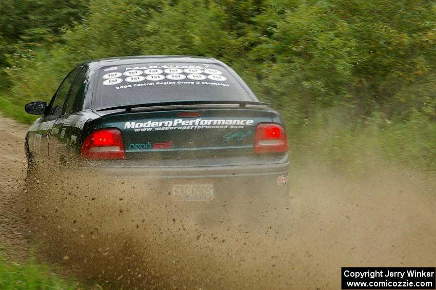 The Chris Greenhouse / Don DeRose Plymouth Neon sprays gravel at a fast right on the practice stage.