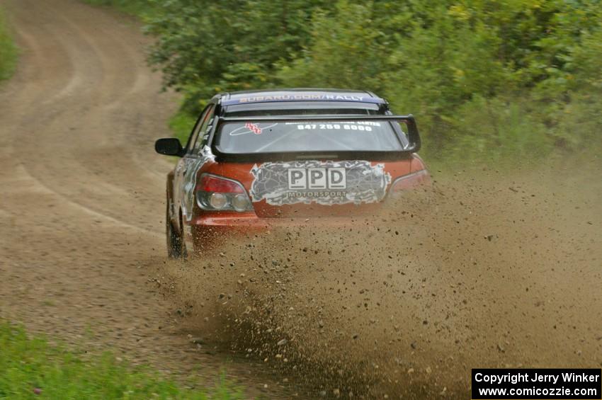 Piotr Wiktorczyk / Grzegorz Dorman slide their Subaru WRX STi through a corner on the practice stage.