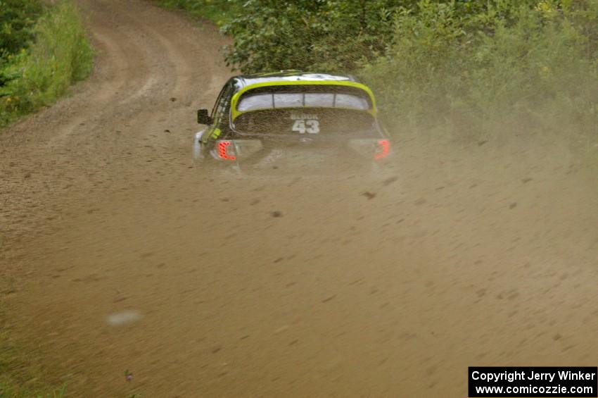 The Ken Block / Alex Gelsomino Subaru Impreza WRX STi exits a right-hander on the practice stage.