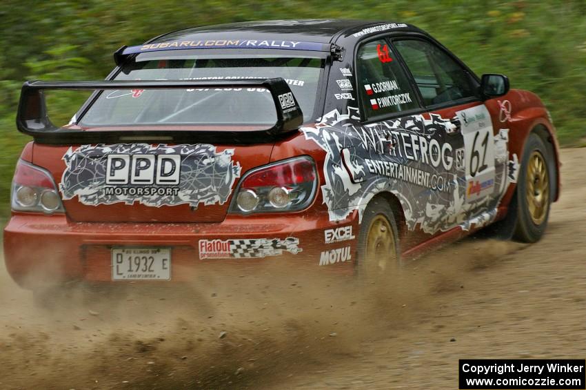 Piotr Wiktorczyk / Grzegorz Dorman sling gravel in their Subaru WRX STi on the practice stage.