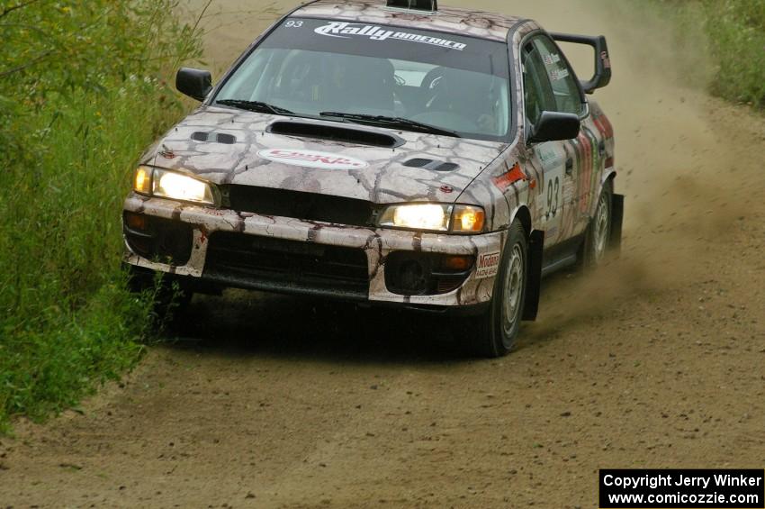 Bob Olson / Conrad Ketelsen hold a close apex on a right-hander on the practice stage in their Subaru Impreza.