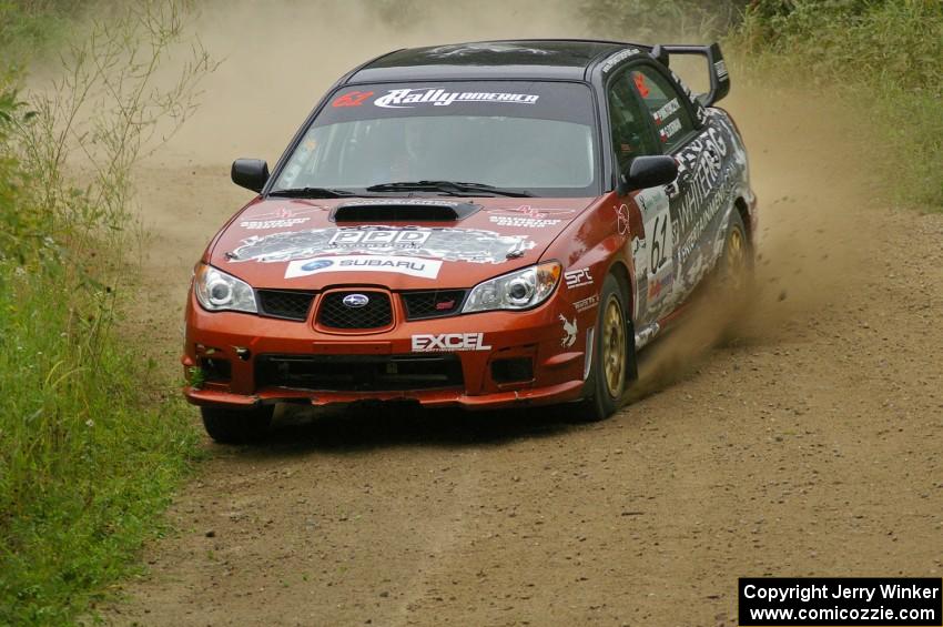 Piotr Wiktorczyk / Grzegorz Dorman Subaru WRX STi drifts through a right-hand corner on the practice stage.