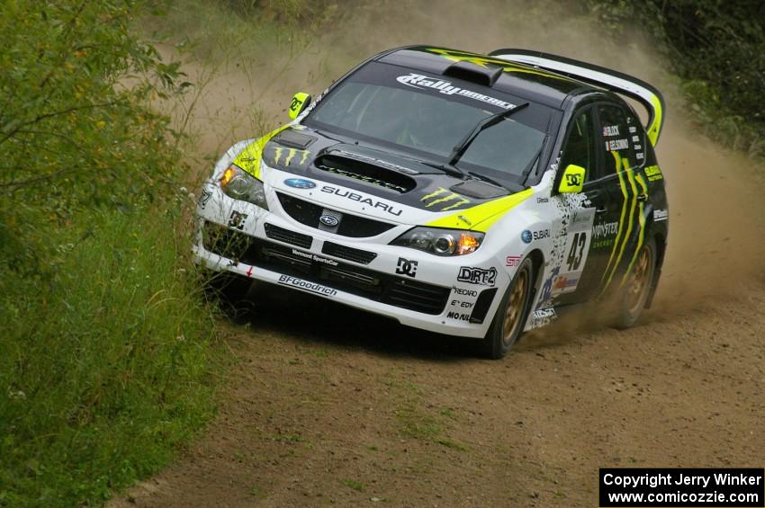 Ken Block / Alex Gelsomino clip the weeds on a practice run in their Subaru Impreza WRX STi.