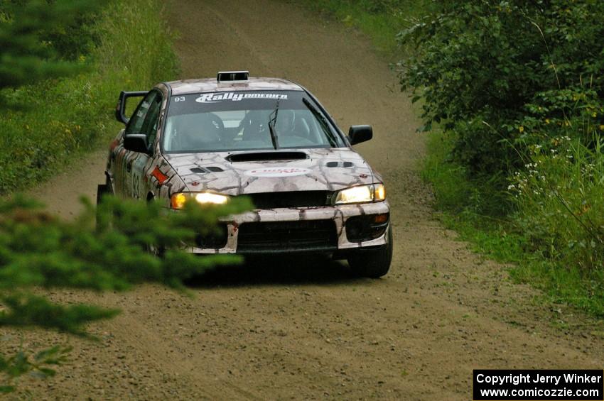 The Bob Olson / Conrad Ketelsen Subaru Impreza at speed on the practice stage.