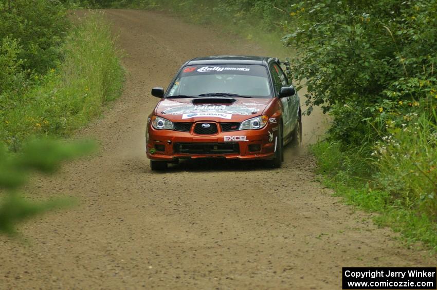 The Piotr Wiktorczyk / Grzegorz Dorman Subaru WRX STi sets up for a left-hand corner on the practice stage.