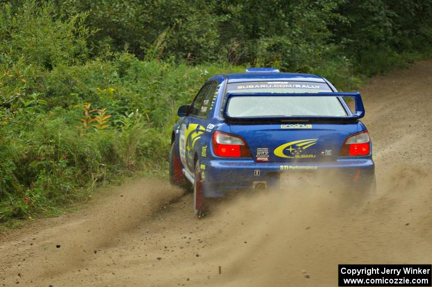 Janusz Topor / Michal Kaminski blast gravel on the practice stage in their Subaru WRX STi.