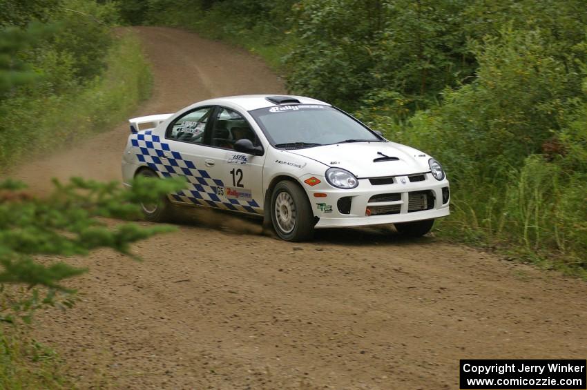 Zach Babcock / Jack Penley set their Dodge SRT-4 up for a left-hander on the practice stage.