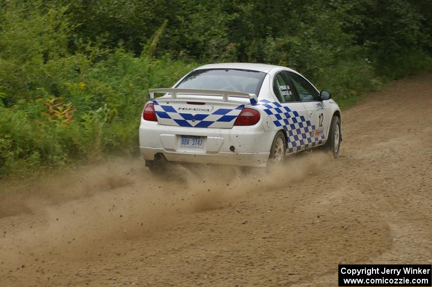 The Zach Babcock / Jack Penley Dodge SRT-4 blasts out of a left-hander on the practice stage.