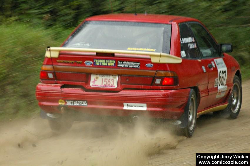 Paul Donlin / Elliot Sherwood slide their Ford Escort on the practice stage.