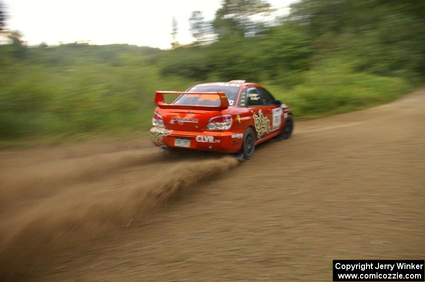 The Nate Conley / Adam Kneipp Subaru WRX STi kick up rooster-tails on the practice stage.