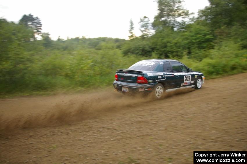 Chris Greenhouse / Don DeRose make a pair of rooster tails off the rear of their Plymouth Neon on the practice stage.