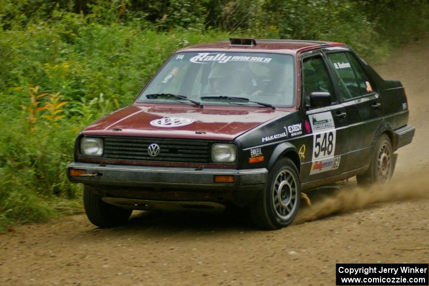 Matt Bushore / Kim DeMotte set their VW Jetta up for a fast right hander on the practice stage.