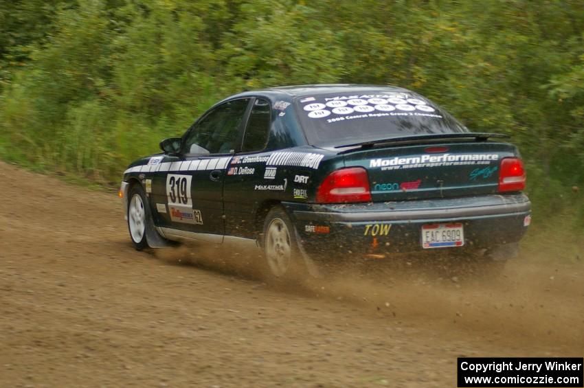 Chris Greenhouse / Don DeRose climb a small rise after a fast right hander in their Plymouth Neon on the practice stage.