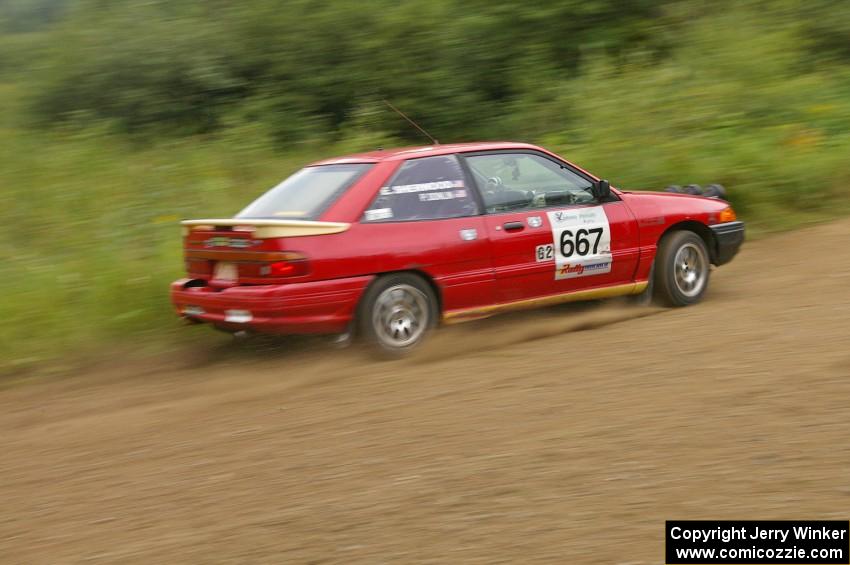 Paul Donlin / Elliot Sherwood slide through a left hander on the practice stage in their Ford Escort.
