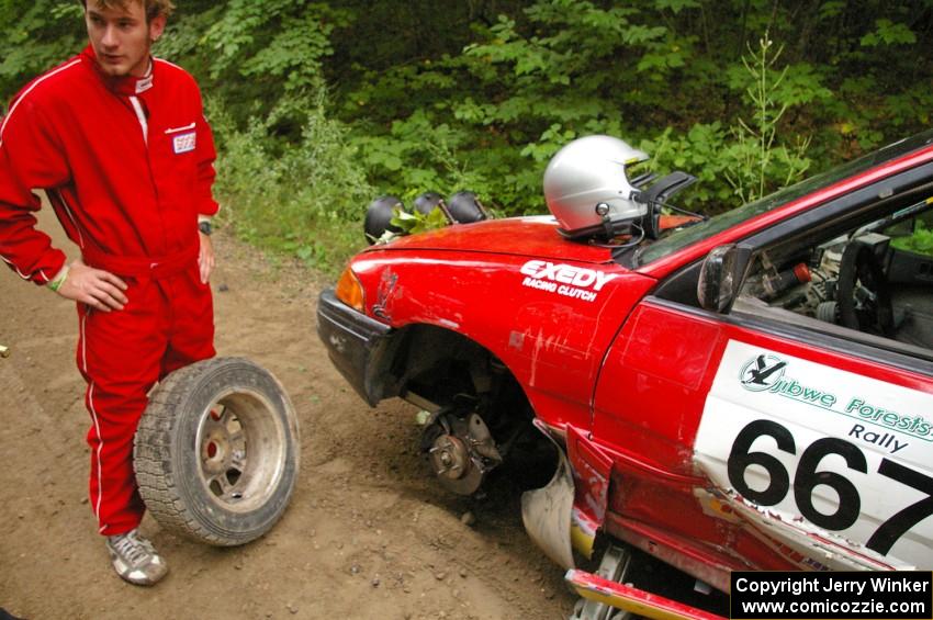 Note the hole punched by the tie rod into the wheel! Paul Donlin / Elliot Sherwood Ford Escort on the practice stage.