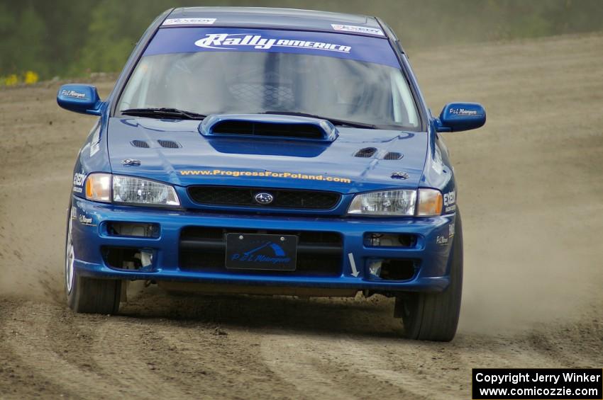 Piotr Fetela / Mariusz Malik slide their Subaru Impreza on the high bank on SS1.