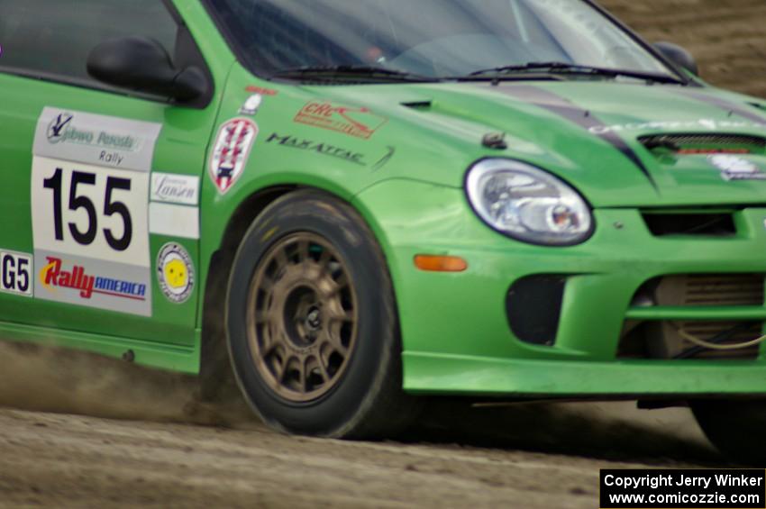 John Conley / Keith Rudolph drive their Dodge SRT-4 off of the high bank on SS1.