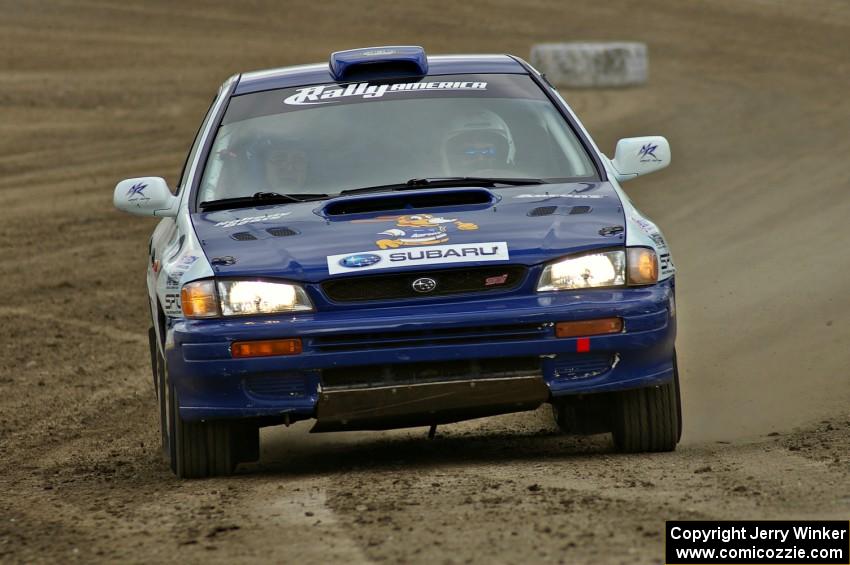 Mason Moyle / Scott Putnam prepare to exit the end of SS1 in their Subaru Impreza.