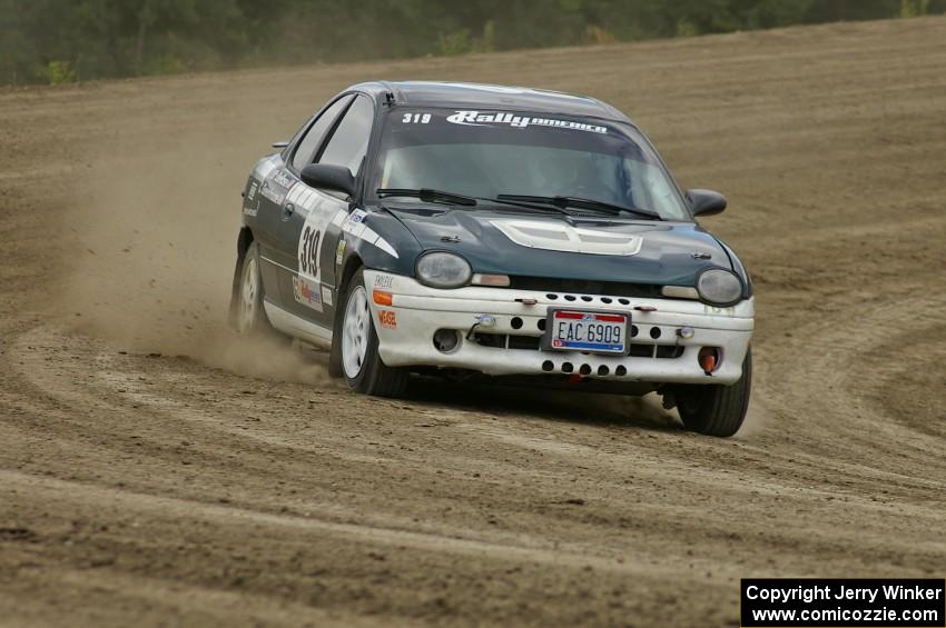 Chris Greenhouse / Don DeRose ride the middle of the bank on SS1 in their Plymouth Neon.