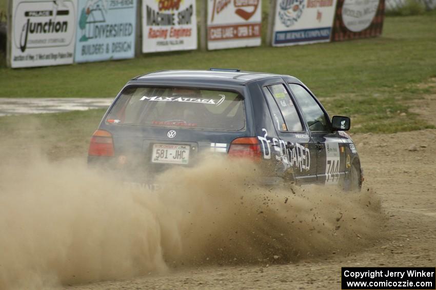 Paul Koll / Heath Nunnemacher come off the bank and set up for a hairpin on SS1 in their VW Golf.