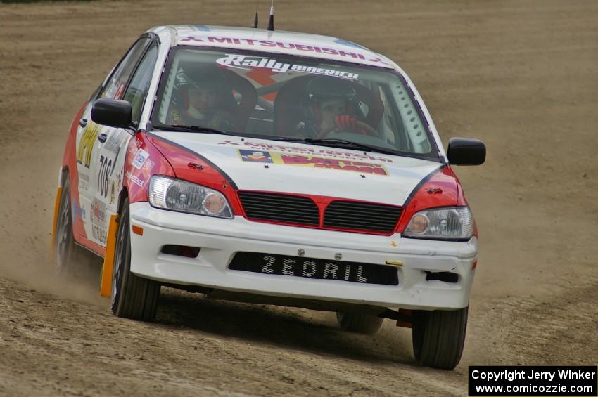 Jan Zedril / Jody Zedril on the high bank of SS1 in their Mitsubishi Lancer ES.