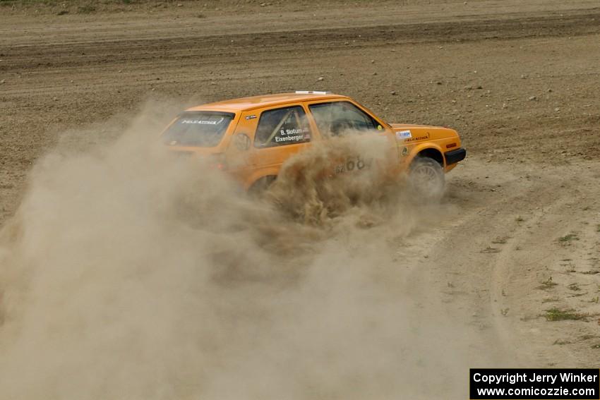 The Chad Eixenberger / Ben Slocum VW Golf drifts hard at a right hander on SS1.