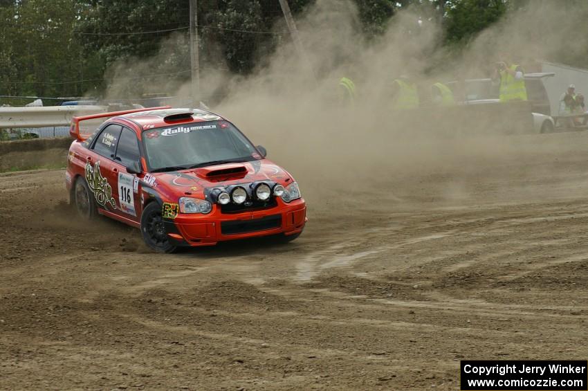 Nate Conley / Adam Kneipp set up nicely for a hairpin in their Subaru WRX STi on SS1.