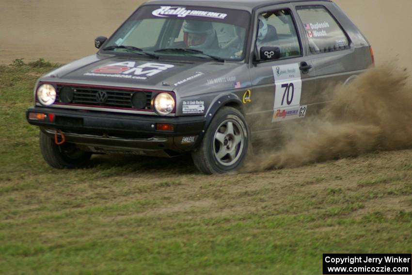 Chris Duplessis / Catherine Woods kick up dirt on SS1 in their VW GTI.