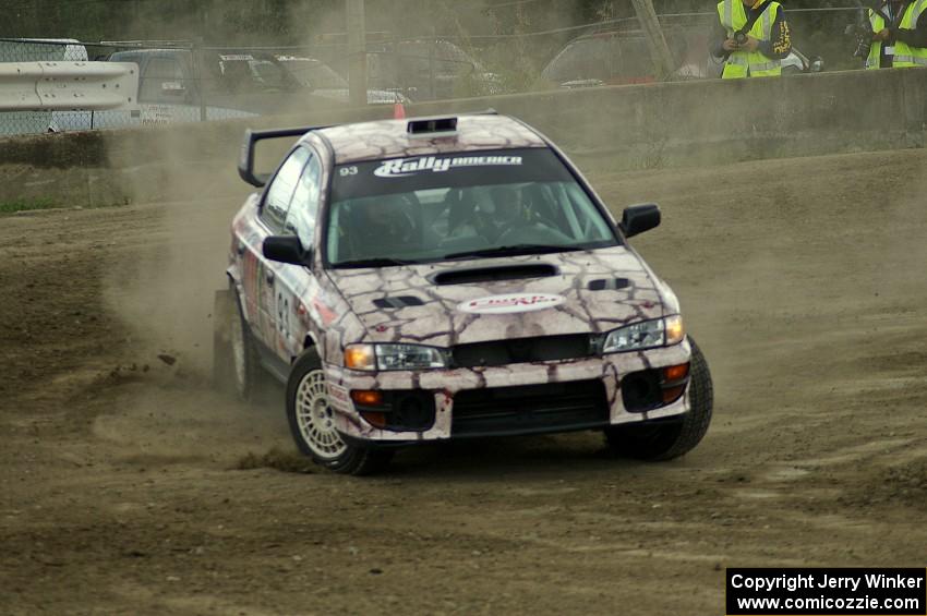 The Bob Olson / Conrad Ketelsen Subaru Impreza drifts hard through a hairpin on SS1.