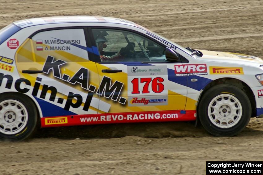 Andi Mancin / Maciej Wislawski Mitsubishi Lancer Evo 9 at speed on SS1.