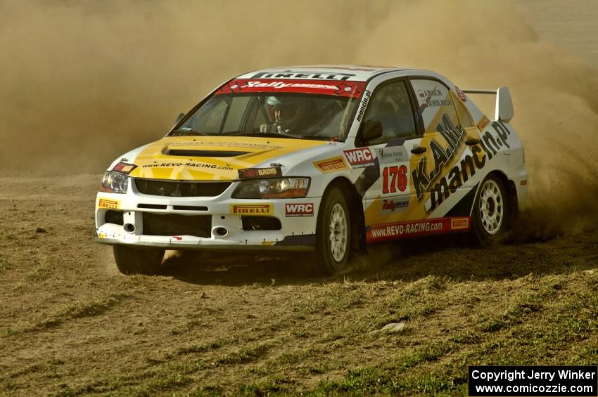 Andi Mancin / Maciej Wislawski throws his Mitsubishi Lancer Evo 9 sideways through infield sweeper on SS1.