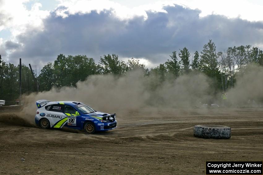 Dust trailing the car mimics the cloud above the Travis Pastrana / Christian Edstrom Subaru WRX STi on SS1.