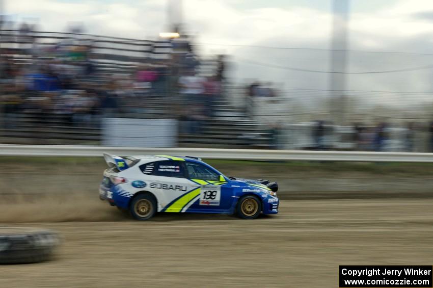 Travis Pastrana / Christian Edstrom cross the finish of SS1 in their Subaru WRX STi.