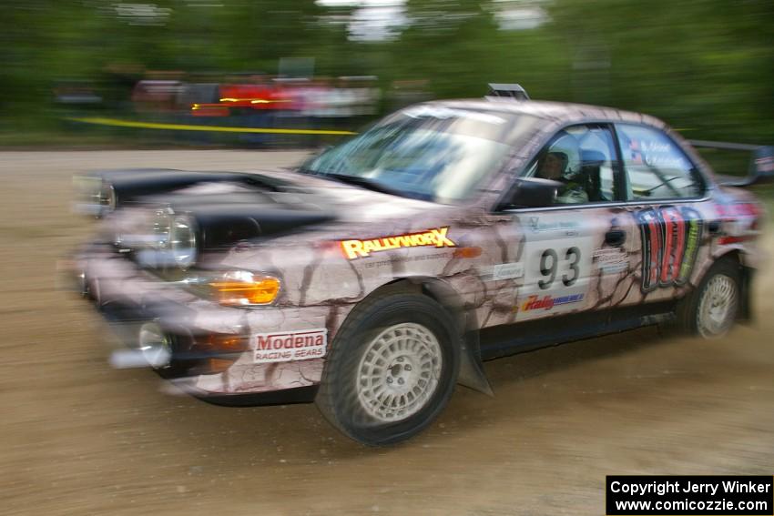 Bob Olson / Conrad Ketelsen fling their Subaru Impreza past marshals at a fast left-hander on SS2.