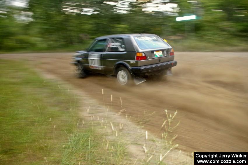 Chris Duplessis / Catherine Woods at speed through a fast left-hand sweeper on SS2 in their VW GTI.