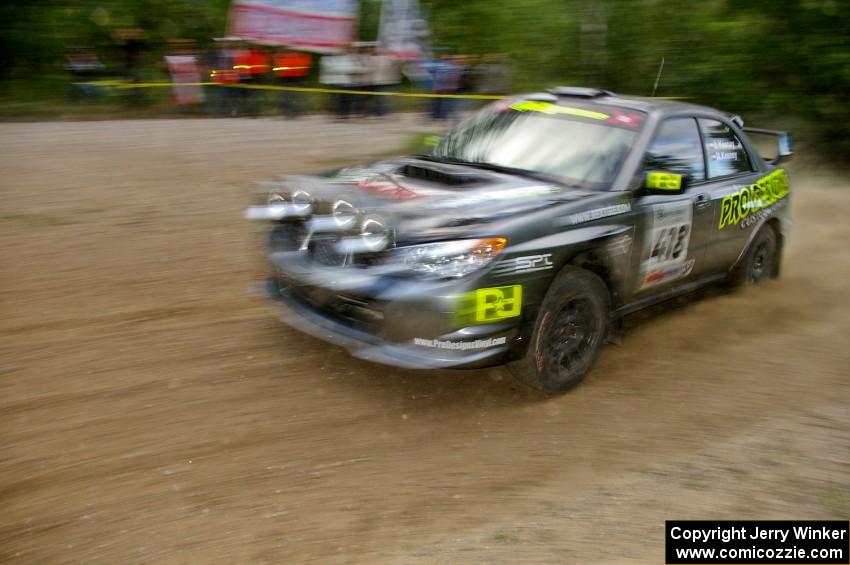 Jimmy Keeney / Missy Keeney at speed through a fast left-hander in their Subaru WRX STi on SS2.