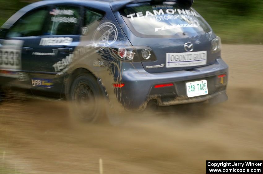 Wyatt Knox / Martin Headland at speed through a fast left-hander on SS2 in their Mazda Speed 3.