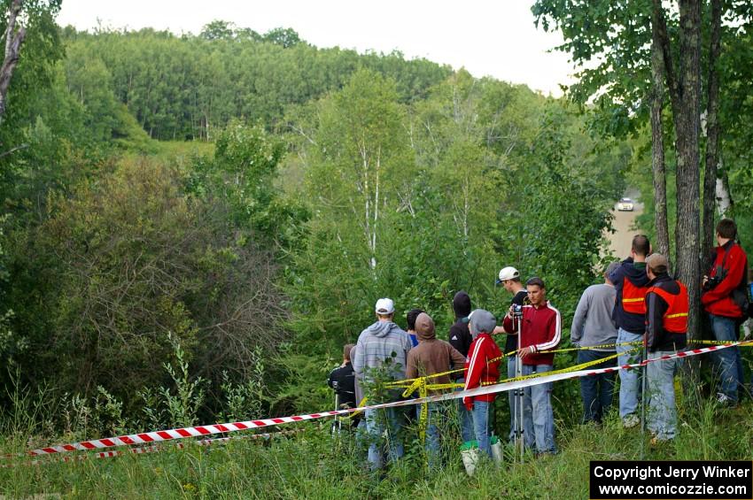 Andi Mancin / Maciej Wislawski in their Mitsubishi Lancer Evo 9 at speed toward a spectator corner on SS4.