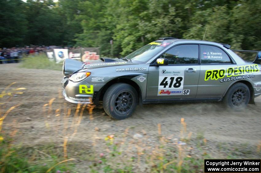 Jimmy Keeney / Missy Keeney fling their Subaru WRX STi in preparation for the uphill hairpin on SS4.