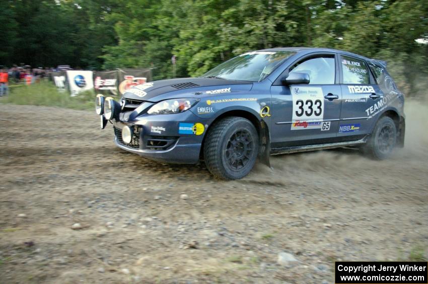Wyatt Knox / Martin Headland prepare for a hard left-hand hairpin on SS4 in their Mazda Speed 3.