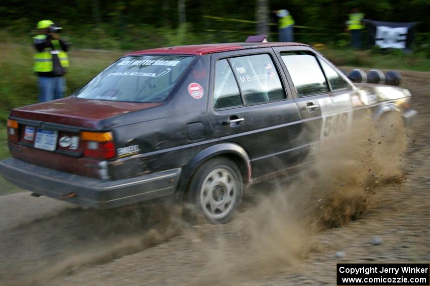 Matt Bushore / Kim DeMotte set their VW Jetta up for the uphill hairpin on SS4.