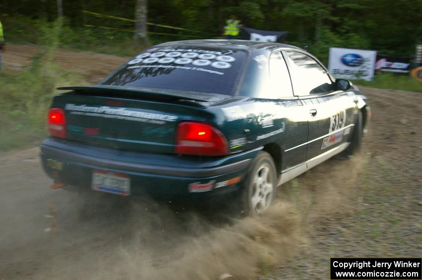 Chris Greenhouse / Don DeRose set up wide in their Plymouth Neon for a run at the uphill hairpin on SS4.