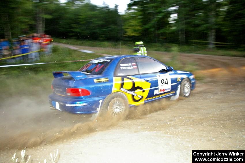 Piotr Fetela / Mariusz Malik fling their Subaru Impreza toward the uphill hairpin on SS4.