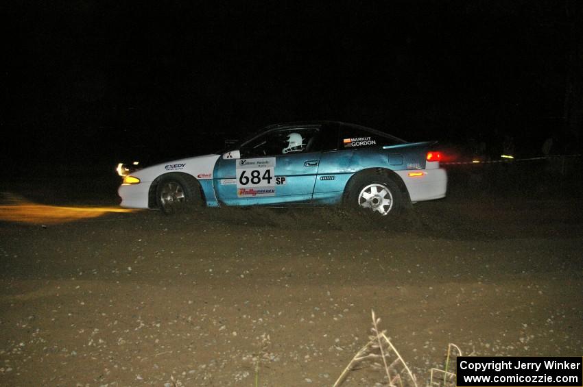 Adam Markut / Chris Gordon set up their Eagle Talon for the spectator-filled downhill hairpin on SS7.