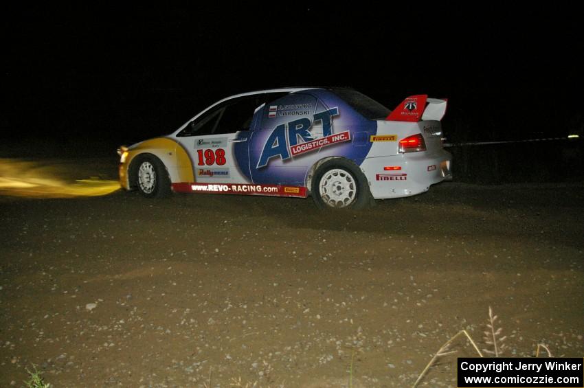 Arkadiusz Gruszka / Lukasz Wronski flog their Mitsubishi Lancer Evo 9 through the downhill right-hand hairpin on SS7.