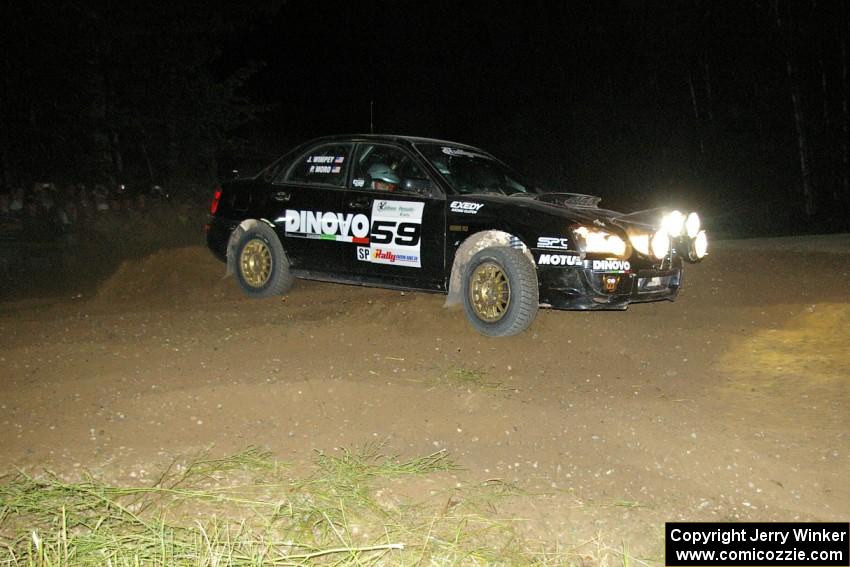 Pat Moro / Jeremy Wimpey drift wide in their Subaru WRX STi through the downhill hairpin on SS7.