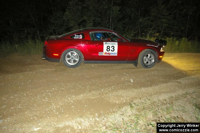 Mark Utecht / Rob Bohn blast away from the downhill hairpin on SS7 in their Ford Mustang.