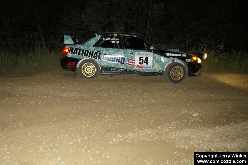 Mark Fox / Jake Blattner drift wide out of the downhill hairpin on SS7 in their Subaru WRX STi.